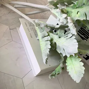 Close-up detail of artificial flocked dusty miller leaves, perfect for floral arrangements.