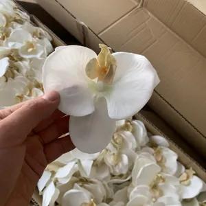 Artificial white orchid flower heads for DIY crafts, clothing, shoes, and hat decorations.