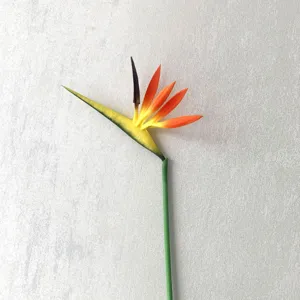 Artificial bird of paradise flower detail shot, single stem silk floral decor for home.