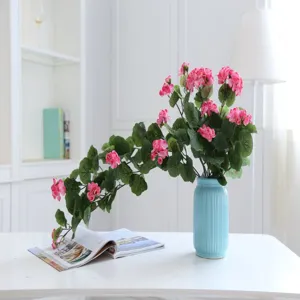 Artificial flower vine detail view, decorative pink floral hanging plant for home room wall decor.