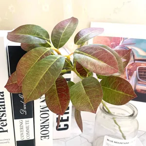 Detailed close-up of artificial coral leaves branch, vibrant green and red tones for home decor.