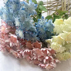 Detailed view of artificial snow lotus dandelion silk flowers bouquet for home decor.