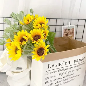 Artificial sunflower bouquet for home decor, pastoral style silk flowers in paper bag.