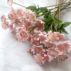 Artificial pink silk flowers bouquet for home wedding and living room decoration.