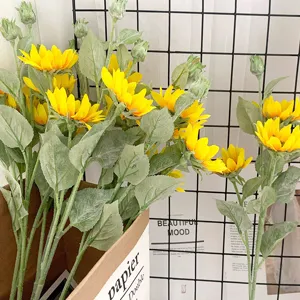 Artificial sunflower bouquet with flocking petals and green leaves, perfect home wedding decor.