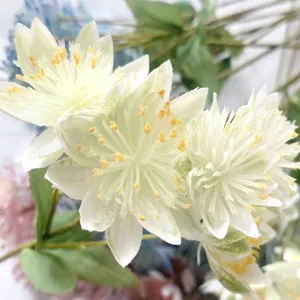 Close-up detail shot of exquisite artificial white snow lotus silk flowers for decor.