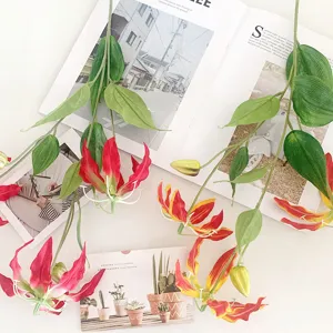Artificial Gloriosa lily flower detail, red yellow petals for home decor or wedding setup.