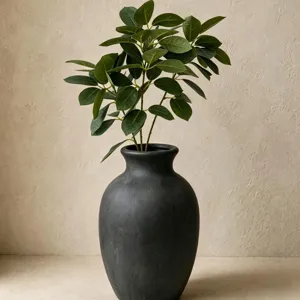 Artificial plant decor with black ceramic vase and green coral leaves for home decor