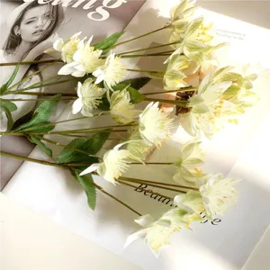 Detailed view of artificial snow lotus dandelion flowers for home and wedding decor setup.
