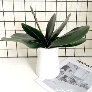 Detail shot of artificial orchid leaves, EVA greenery for flower arrangements and home decor.