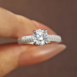 1 carat moissanite ring in 925 sterling silver, stunning half pave diamond band close up.