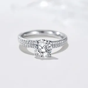 Exquisite 1 carat moissanite ring detail showcasing brilliant solitaire and paved sterling band.