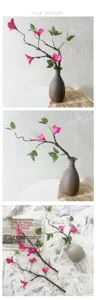 Artificial bougainvillea branches with ceramic vase, perfect for home and living room decor.