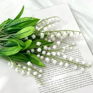 Artificial lily of the valley flower bouquet detail view, soft plastic material fresh style.