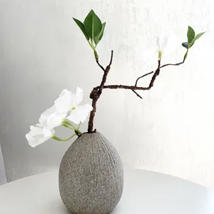 Artificial flower branch simulation twig home decor vase detail shot for wedding styling
