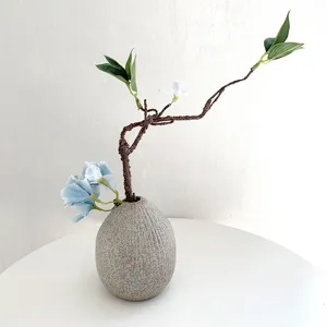 Artificial flower branch and ceramic vase set, flexible faux withered vine for home decor.