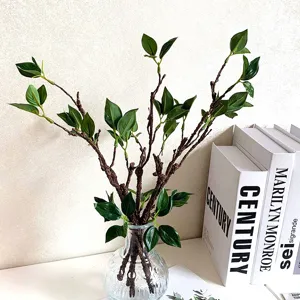 Artificial flower foamed branches in glass vase, flexible vine decor for home and wedding.