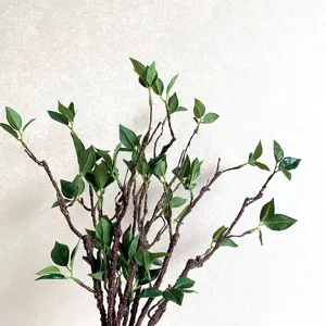 Artificial branch twig with green leaves for home decor, floral arrangement, and wedding.