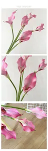 Détail de fleur de lys calla artificiel, pétales roses et tige verte, accessoire de déco.