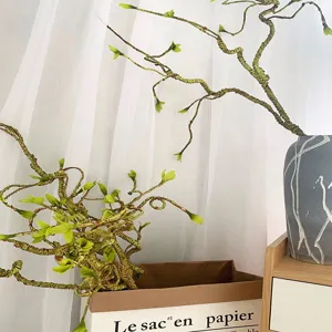 Artificial dry branches detail showing realistic twisted rattan and green sprouts for home decor.