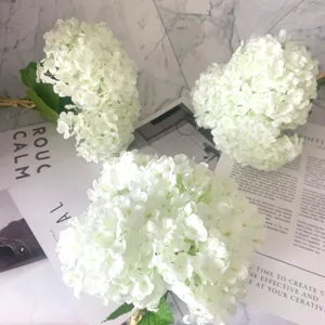 Artificial single hydrangea bouquet with leaves, realistic silk flower for wedding decor photography.