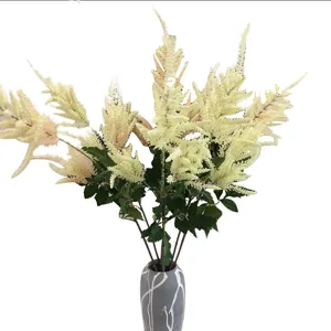 Artificial astilbe flower bouquet in grey ceramic vase for wedding home decor and floral arrangement.