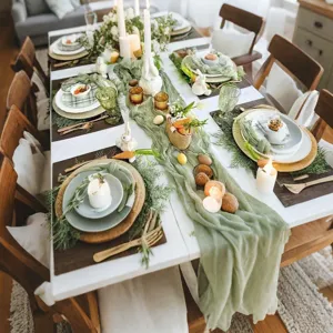 Detailed view of sage green cheesecloth table runner showcasing delicate wrinkles and elegant fabric texture.