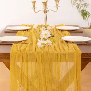 Yellow gauze table runner with pleats, elegant home table decor for weddings and parties.