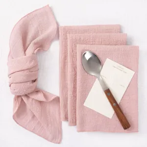 Pink textured gauze table napkins set for wedding party dinner table decoration elegant design.