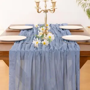 Dusty blue cheesecloth table runner scene detail, elegant wedding party rustic decor style.