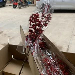 Artificial red winterberry branches detail view, perfect for holiday floral decor and home arrangement.