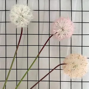 Artificial dandelion flower stem detail shot, minimalist style home decor floral design.