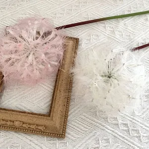 Artificial dandelion flower detail, pink and white fluffy floral arrangement decor
