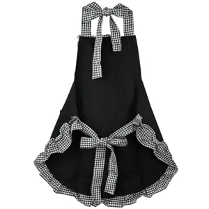 Close-up detail of black kitchen apron with cute black and white gingham ruffles and ties.