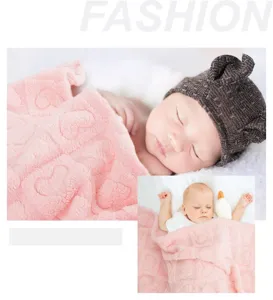 Soft pink plush baby blanket detail view, embossed heart pattern for cozy nursery nap time.