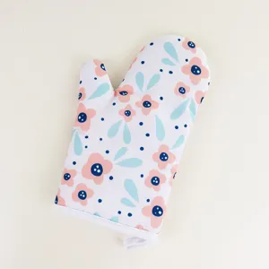 Floral oven mitt detail shot, heat resistant kitchen baking glove with hanging loop.