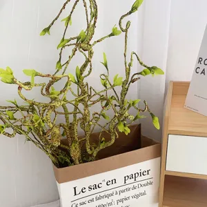 Artificial twisted branches for home decor, realistic green sprouts fake plant setup.