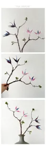 Détail de la branche de fleur artificielle flexible montrant des courbes et des feuilles.
