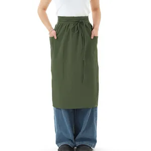 Grembiule da cucina vintage in cotone verde scuro con tasche per cottura e lavoro.