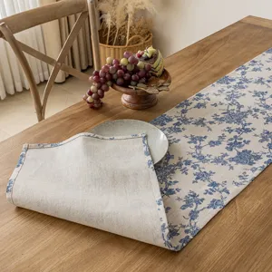 Cotton linen blue floral table runner, elegant home decor detail for dining table setting.