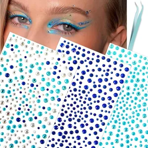 Face rhinestone stickers detail view, showing blue crystal gems and applicator tweezers.