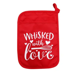 Red insulated pot holder with whisk and heart print, ideal for kitchen baking, heat resistant pad.