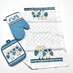 Kitchen textile set includes oven mitt, pot holder and towel with cute owl pattern in blue.