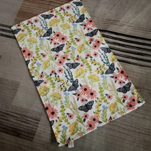Cotton floral dish towel with butterfly print, absorbent kitchen tea towel for home use.