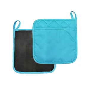 Close-up detail of thickened kitchen pot holder with anti-slip backing and hanging loop.
