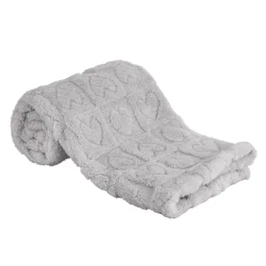 Detail closeup of fluffy grey baby heart blanket showing soft fleece nap texture.