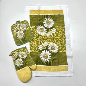 Daisy floral print kitchen textile set including oven mitt, pot holder and soft kitchen towel.