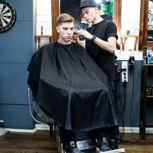 Waterproof barber cape for professional salon hair cutting and styling use in detail.