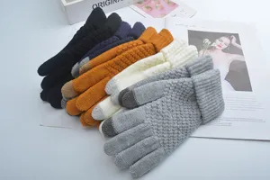Detailed view of winter knitted touchscreen gloves in multiple colors, warm and cozy fabric.