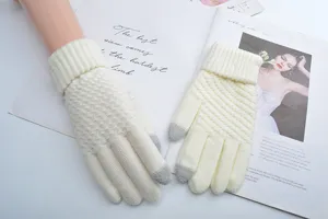 Detailed view of winter knit touch screen gloves in soft beige with ribbed cuffs.